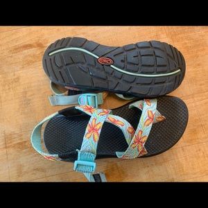 orange and blue flower printed chacos